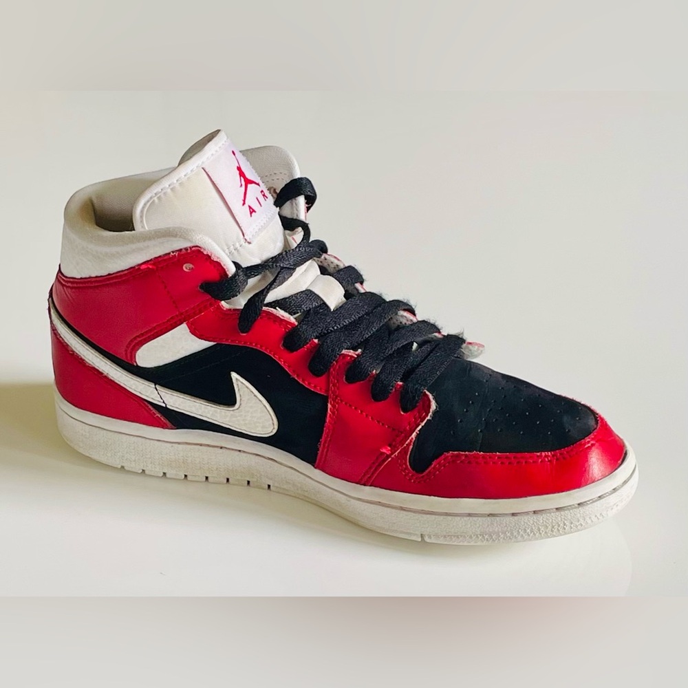 Red, Black, and White Colored Pair of Nike Air Jordans. 7.5 Mens, Mid top.